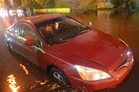 Miami_tidal_flooding_with_rain_at_high_tide_during_king_tides_38_Edgewater_flooded_car.jpg